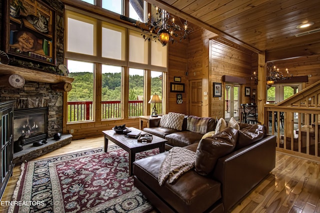 1551 Mountain Dreams Way, Sevierville, TN 37862 - living area with a chandelier, wooden ceiling, and a healthy amount of sunlight