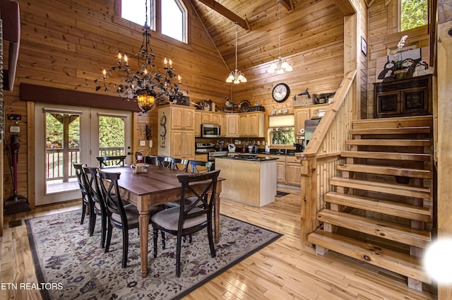 1551 Mountain Dreams Way, Sevierville, TN 37862 - dining area with light wood-style floors, high vaulted ceiling, plenty of natural light, and a notable chandelier