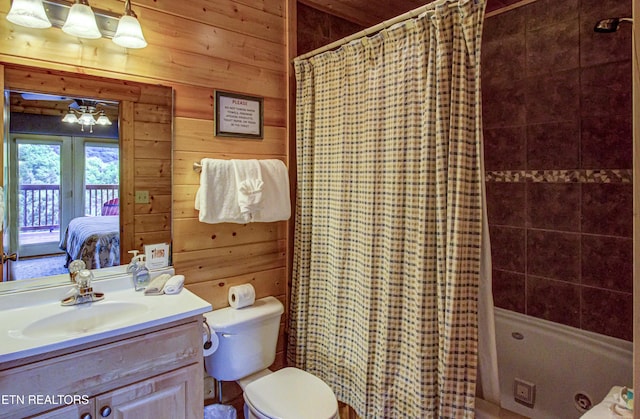 1551 Mountain Dreams Way, Sevierville, TN 37862 - full bath featuring wooden walls, vanity, shower / bath combo with shower curtain, and connected bathroom