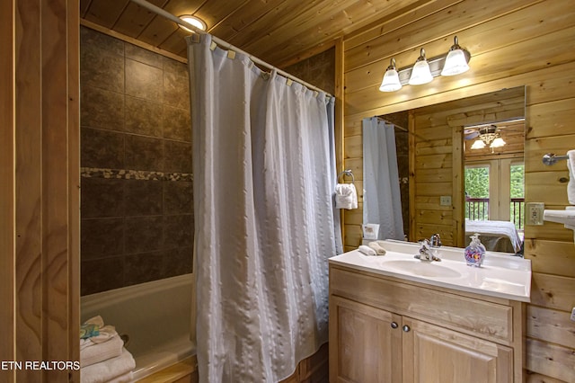 1551 Mountain Dreams Way, Sevierville, TN 37862 - ensuite bathroom with vanity, shower / bath combination with curtain, ensuite bathroom, wooden walls, and wooden ceiling