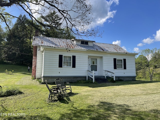 123 Sexton Ln, Clinton, TN 37716 - rear view of property with a lawn, metal roof, and a chimney