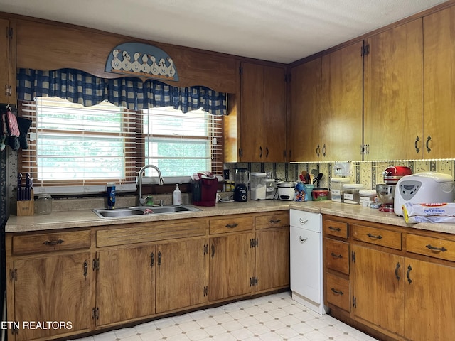 123 Sexton Ln, Clinton, TN 37716 - kitchen with a sink, light flooring, brown cabinetry, and light countertops