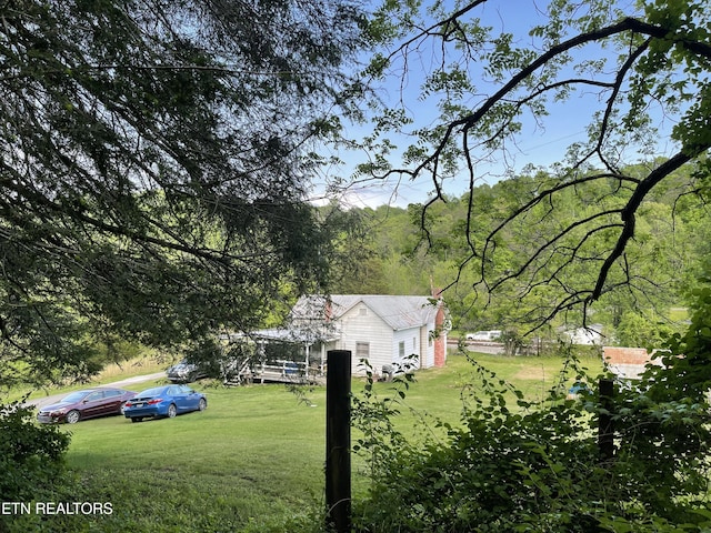 123 Sexton Ln, Clinton, TN 37716 - view of green lawn featuring a wooded view