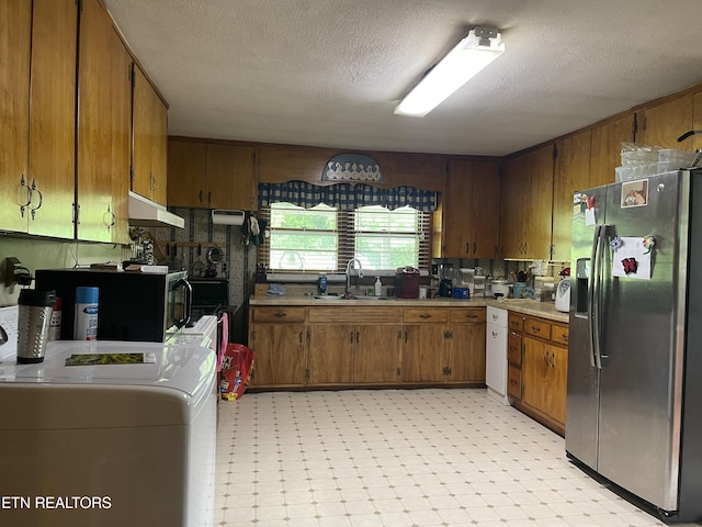 123 Sexton Ln, Clinton, TN 37716 - kitchen with stainless steel refrigerator with ice dispenser, a sink, light flooring, light countertops, and under cabinet range hood