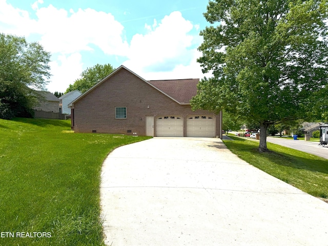 view of front facade with concrete driveway, an attached garage, a front lawn, and brick siding