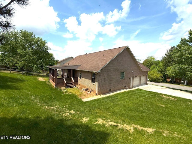 rear view of house featuring covered porch, brick siding, concrete driveway, a garage, and a lawn