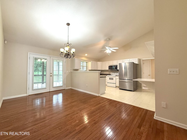 kitchen featuring white cabinetry, lofted ceiling, wood-type flooring, and appliances with stainless steel finishes