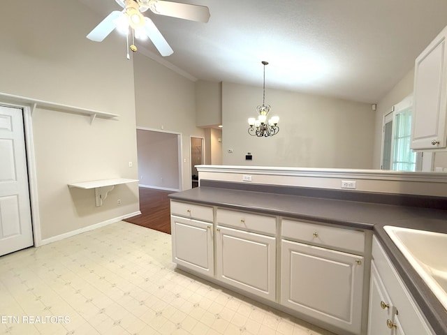 kitchen featuring ceiling fan with notable chandelier, a sink, open shelves, white cabinets, and light floors