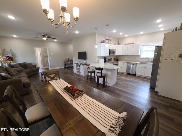 106 Maca Ridge Cir, Clarkrange, TN 38553 - living room with a ceiling fan, dark wood finished floors, a chandelier, recessed lighting, and baseboards