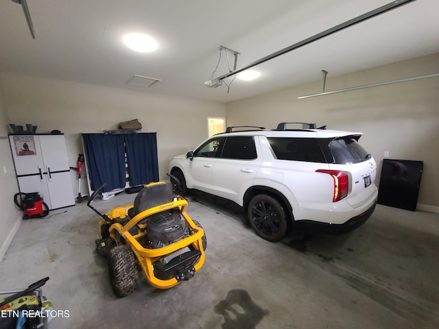 106 Maca Ridge Cir, Clarkrange, TN 38553 - garage with a garage door opener and baseboards