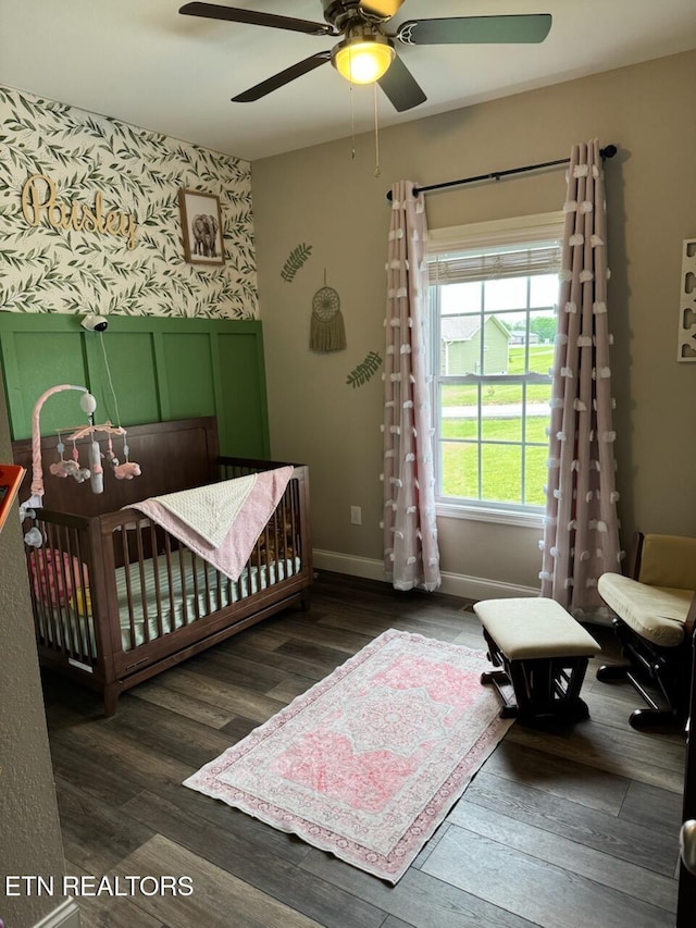 106 Maca Ridge Cir, Clarkrange, TN 38553 - bedroom featuring wood finished floors, baseboards, a ceiling fan, and a crib