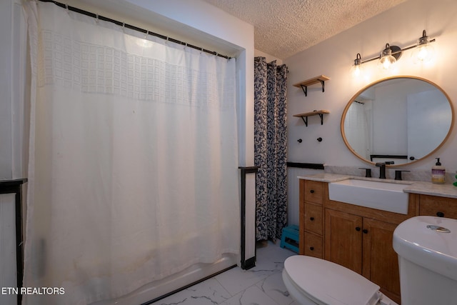 10724 E Emory Rd, Luttrell, TN 37779 - full bath featuring toilet, marble finish floors, a textured ceiling, and vanity