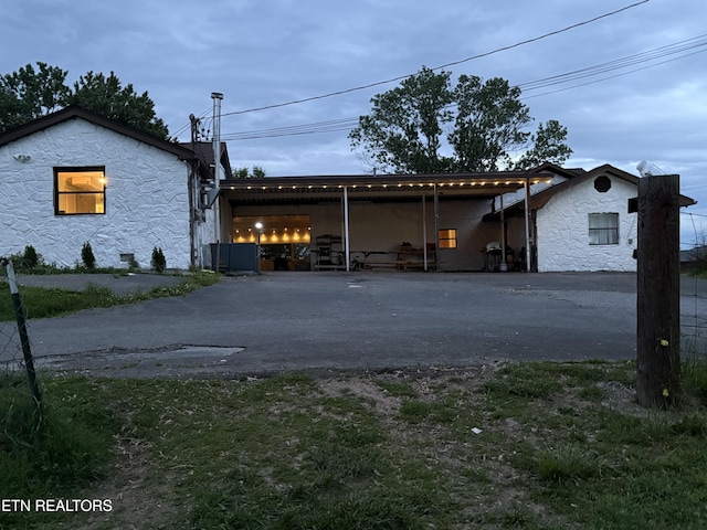 10724 E Emory Rd, Luttrell, TN 37779 - view of front of home featuring stone siding and asphalt driveway