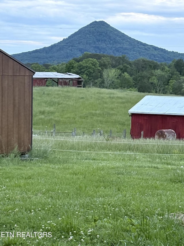 10724 E Emory Rd, Luttrell, TN 37779 - view of yard featuring a mountain view, an outbuilding, a view of countryside, and a pole building