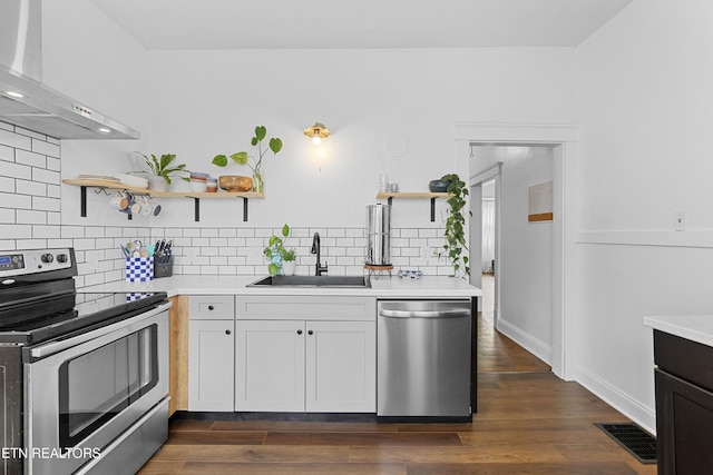 1321 N 4th Ave, Knoxville, TN 37917 - kitchen with visible vents, open shelves, wall chimney exhaust hood, a sink, and appliances with stainless steel finishes