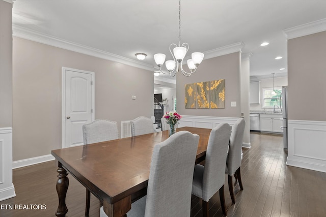 1724 Golden Nugget Ln, Knoxville, TN 37932 - dining space featuring a chandelier, crown molding, dark wood finished floors, recessed lighting, and a wainscoted wall