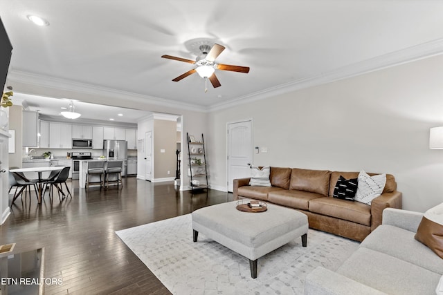1724 Golden Nugget Ln, Knoxville, TN 37932 - living area featuring a ceiling fan, baseboards, ornamental molding, dark wood finished floors, and recessed lighting