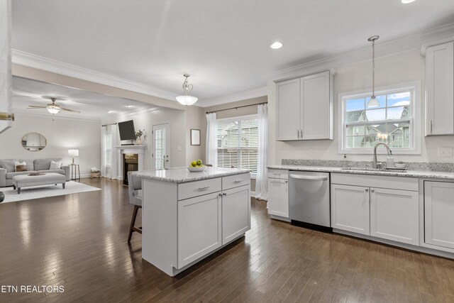 1724 Golden Nugget Ln, Knoxville, TN 37932 - kitchen with stainless steel dishwasher, a sink, open floor plan, a kitchen island, and healthy amount of natural light
