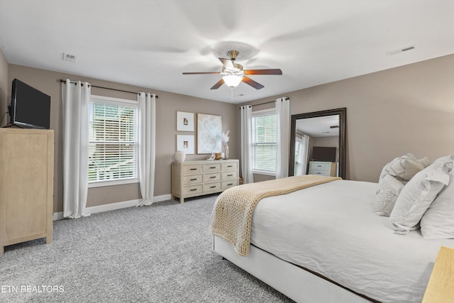 1724 Golden Nugget Ln, Knoxville, TN 37932 - bedroom with multiple windows, baseboards, light colored carpet, and a ceiling fan