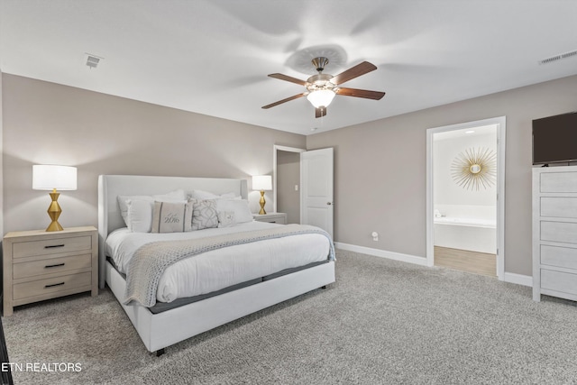 1724 Golden Nugget Ln, Knoxville, TN 37932 - carpeted bedroom featuring baseboards, ensuite bathroom, and a ceiling fan