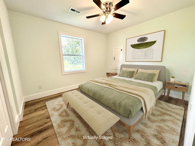 210 Spruce St, Athens, TN 37303 - bedroom with a ceiling fan, baseboards, visible vents, and wood finished floors