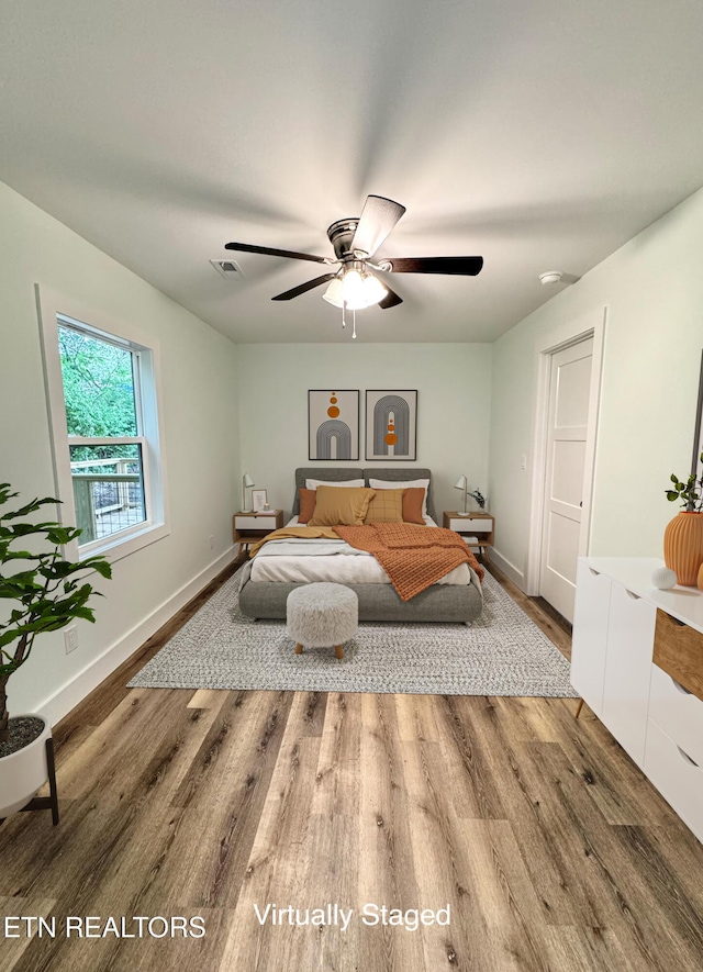 210 Spruce St, Athens, TN 37303 - bedroom with baseboards, ceiling fan, wood finished floors, and visible vents