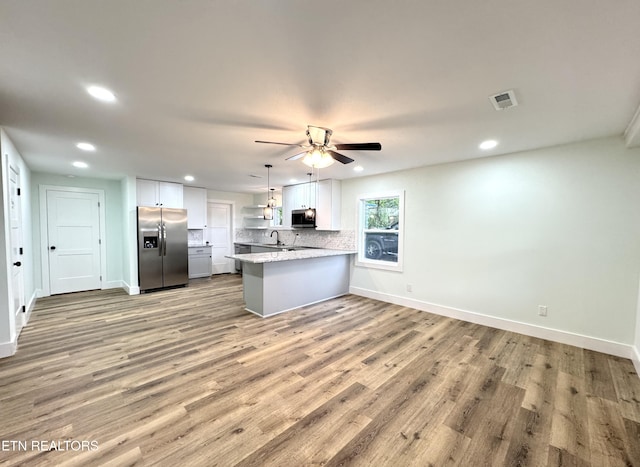 210 Spruce St, Athens, TN 37303 - kitchen with ceiling fan, a sink, stainless steel appliances, recessed lighting, and a peninsula