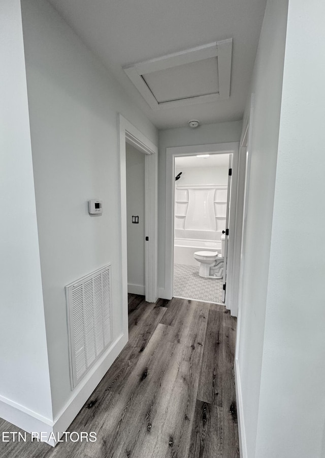 210 Spruce St, Athens, TN 37303 - hallway with visible vents, attic access, baseboards, and wood finished floors