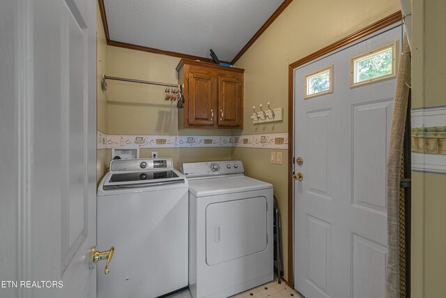 laundry room with ornamental molding, a textured ceiling, a wainscoted wall, cabinet space, and independent washer and dryer