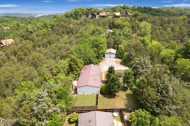 aerial view featuring a view of trees