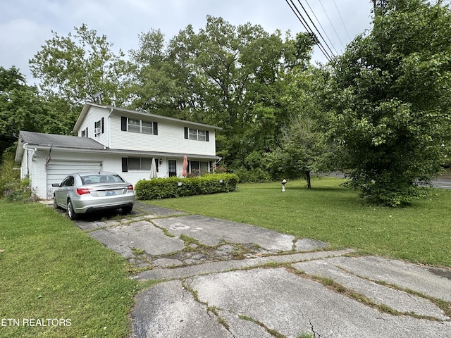 view of front of home with a front lawn and aphalt driveway