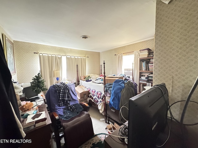 bedroom with visible vents, carpet flooring, and wallpapered walls