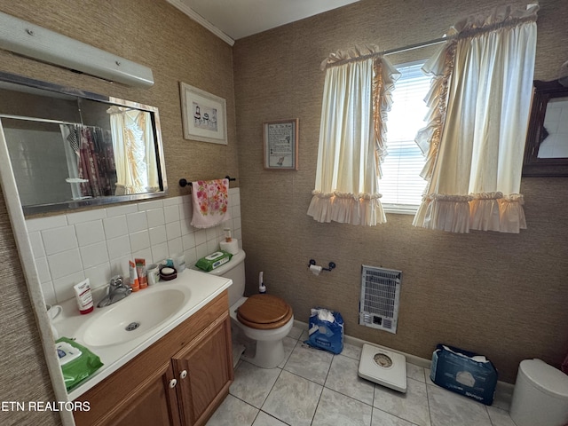 bathroom featuring a shower with curtain, tile patterned flooring, vanity, toilet, and heating unit