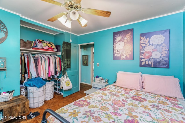 bedroom with a closet, ceiling fan, and crown molding