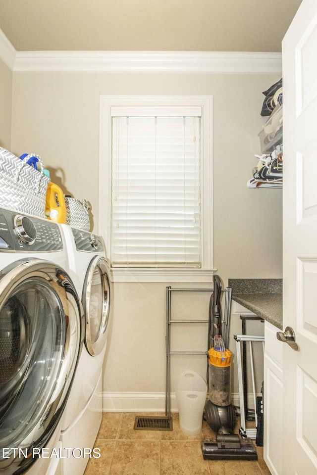 719 Lake Vista Ln Unit 3, Knoxville, TN 37934 - washroom featuring crown molding, laundry area, tile patterned flooring, baseboards, and washer and clothes dryer