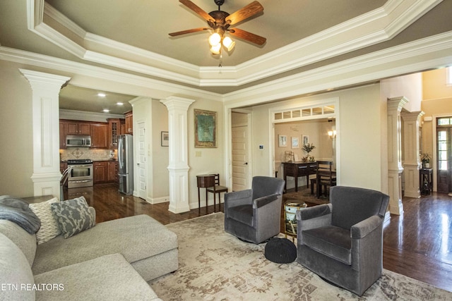 719 Lake Vista Ln Unit 3, Knoxville, TN 37934 - living area with crown molding, ceiling fan, decorative columns, and dark wood-type flooring