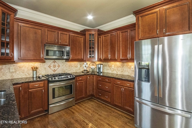 719 Lake Vista Ln Unit 3, Knoxville, TN 37934 - kitchen with glass insert cabinets, appliances with stainless steel finishes, dark stone countertops, and dark wood-type flooring