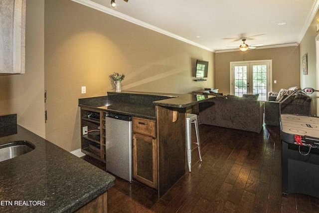 719 Lake Vista Ln Unit 3, Knoxville, TN 37934 - kitchen featuring french doors, refrigerator, open floor plan, ornamental molding, and dark wood-type flooring