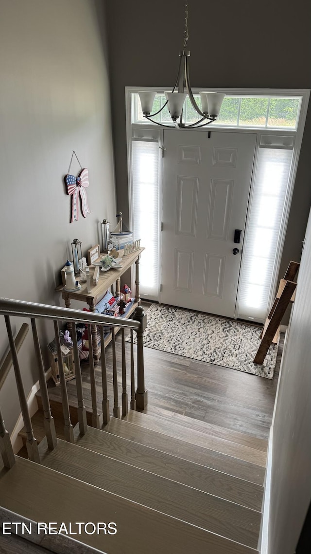344 Kayla Ln, Oneida, TN 37841 - entrance foyer with an inviting chandelier, stairs, and wood finished floors