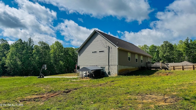 344 Kayla Ln, Oneida, TN 37841 - view of home's exterior with a lawn and a deck