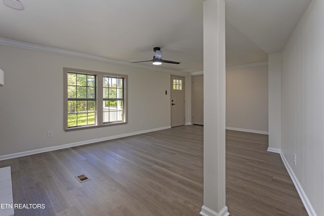 unfurnished living room with ceiling fan, ornamental molding, wood finished floors, and visible vents