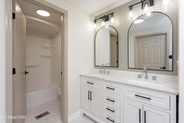 full bathroom with visible vents, a sink, baseboards, and double vanity
