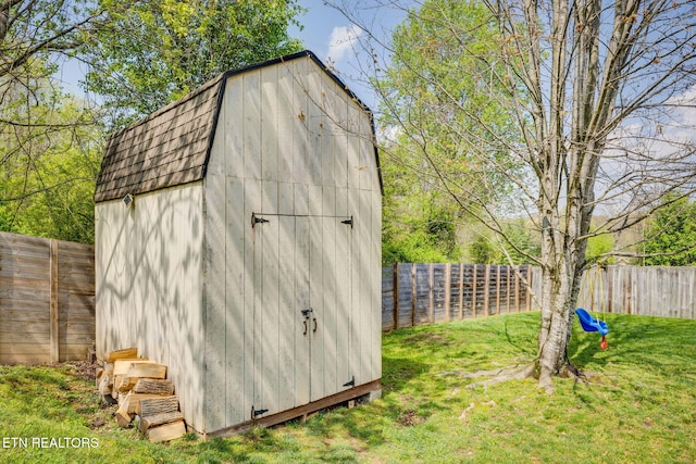 view of shed featuring a fenced backyard