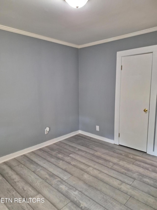 5828 Eldridge Rd, Knoxville, TN 37918 - empty room with crown molding, baseboards, and wood finished floors
