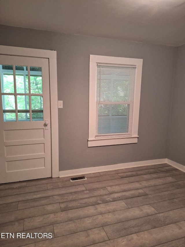 5828 Eldridge Rd, Knoxville, TN 37918 - doorway to outside with baseboards, visible vents, and wood finished floors