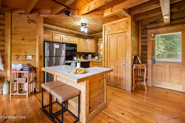 kitchen with tile counters, electric range, black microwave, and wooden ceiling