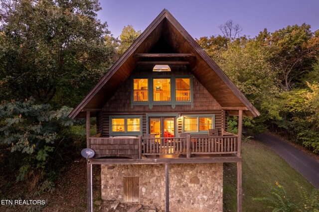 rear view of property with a lawn