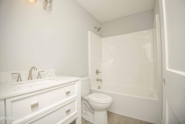3328 Wimpole Ave, Knoxville, TN 37914 - bathroom featuring toilet, shower / washtub combination, wood finished floors, and vanity
