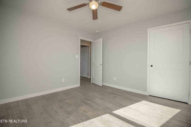 3328 Wimpole Ave, Knoxville, TN 37914 - unfurnished bedroom with baseboards, a ceiling fan, and wood finished floors