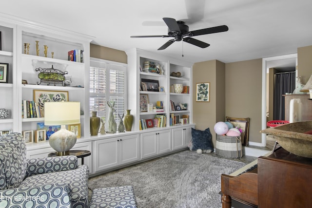 living area featuring ceiling fan